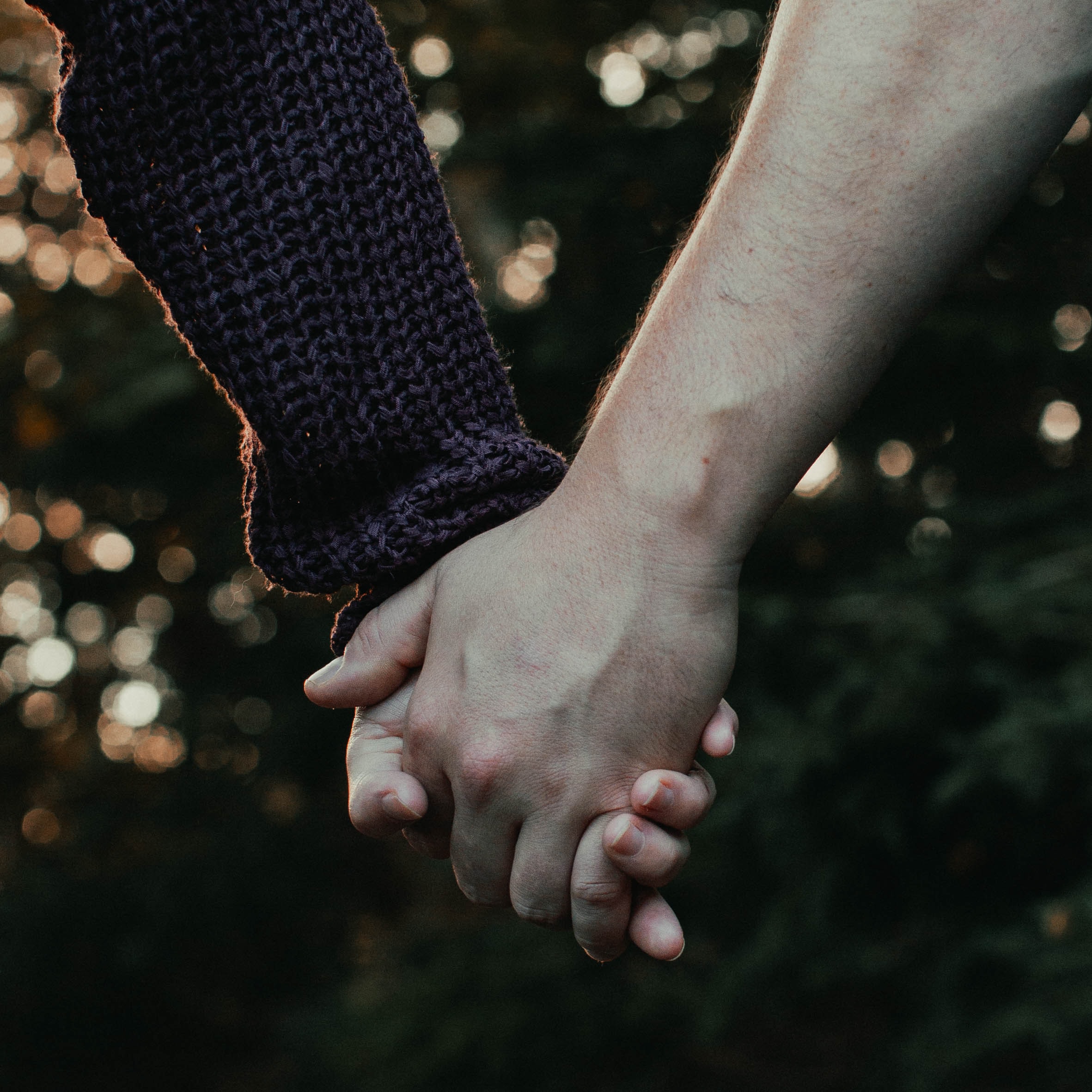 Two People holding hands on a walk, showing increased bonding and empathy