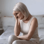 Woman in midlife practicing mindfulness to reduce perimenopause anxiety