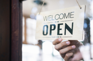 Image of sign saying "welcome" and "open"