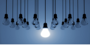 Burnout symptoms, one light bulb shining while the others are burnt out